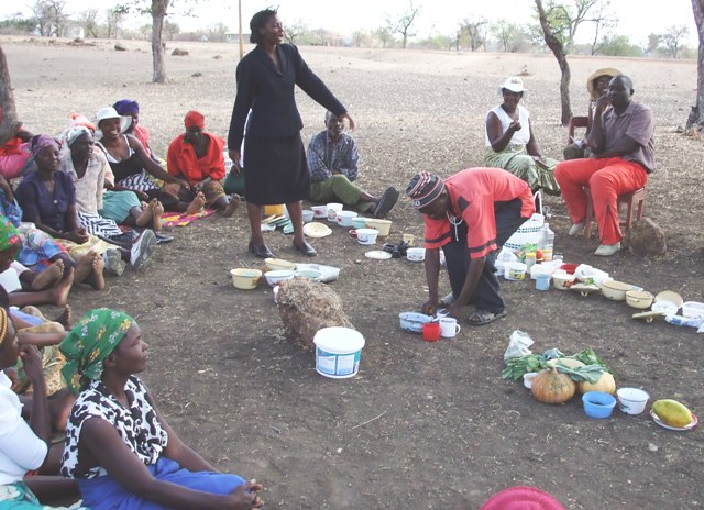 In the barren district of chiping, women gather to discuss nutrition, sorting the food they have brought in the food groups to learn how to have a balance diet 